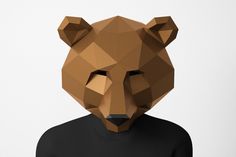 a person with a bear mask on their head and black t - shirt in front of them