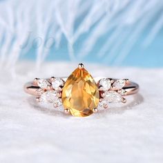 This 925 Sterling Silver yellow Citrine Ring is a stunning way to symbolize your everlasting love. Means Love your lover/Wife/Girlfriend 7 Days A Week. A dramatic choice for an engagement, wedding or to simply let someone know just how much you love them, our handmade Multi stone diamond rings are the quality choice.  PERFECT FOR GIFTING: This dainty yellow Citrine ring come in a delicate jewelry box, represents the birthstone of November, best gift option for special someone was born in November .It's a good choice of an anniversary, engagement, birthday, Mother's Day gifts, Christmas day,  Thanksgiving Day, Valentine's Day gift for a couple, friend, family.  Accept engrave the words inside the ring service: https://www.etsy.com/listing/1103764936/engrave-service HOW TO STYLE : This blue Birthstone Engagement Rings November, Pear-shaped Yellow Diamond Ring For Wedding, Fine Jewelry Pear-shaped Topaz Ring For Anniversary, Pear-shaped Topaz Ring For Anniversary, Fine Jewelry, Pear-shaped Topaz Ring For Anniversary, Pear Shaped Solitaire Wedding Rings, Yellow Topaz Sterling Silver Wedding Ring, Yellow Topaz Ring With Halo Setting For Wedding, White Gold Citrine Topaz Wedding Ring