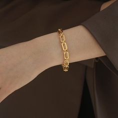 ✦ Make a statement with our bold 18K gold plated bracelet, crafted in a thick chain style for an eye-catching look. Designed to elevate your wrist with timeless elegance, this bracelet is perfect for adding a touch of sophistication to any outfit. With its bold design and luxurious gold plating, it's the ultimate accessory for making a chic and confident impression. ----------- DETAILS ----------- - Color: Gold - Size (Length x Width): 17.8cm x 0.7cm - Materials: Brass, 18K Gold Plated - SKU: QT Modern Chunky Link Bracelets, Modern Chunky Link Bracelet, Modern Chunky Gold Bracelets, Modern Chunky Bracelets For Everyday, Chunky Elegant Bracelet For Everyday, Gold Chunky Chain Link Bracelet, Trendy Oval Link Chain Bracelet For Formal Occasions, Elegant Chain Bracelet With Chunky Oval Links, Chic Oval Link Chain Bracelet For Formal Occasions