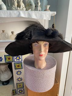 Outstanding late Edwardian black hat with intricate feather swirl design and two hatpins. Extremely rare Very good antique condition. Some loss of condition due to age but overall no major issues. Still strong and wearable with care. Head circumferance 22" Diameter 19"x15" Victorian Costume Hat With Curved Brim, Black Brimmed Hat With Feathers, Vintage Evening Fascinator With Feathers, Victorian Wide Brim Hat For Church, Victorian Black Hat For Weddings, Black Victorian Hat For Wedding, Black Victorian Hat For Evening, Black Victorian Evening Hat, Black Victorian Wedding Hat