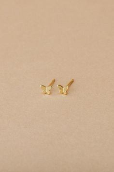 Mariposa is our tiny gold vermeil butterfly stud, the only thing better than flowers is butterflies. We love to wear our Mariposa solo or layer with a hoop. - 3D gold vermeil butterfly stud detail with butterfly closure - .5mm width, 4mm length, 1mm thick - nickel free - hypoallergenic Dainty Gold Butterfly Jewelry, Everyday Gold Butterfly-shaped Jewelry, Minimalist Yellow Gold Butterfly Jewelry, Hypoallergenic Yellow Gold Butterfly Jewelry, Hypoallergenic Butterfly-shaped Yellow Gold Jewelry, Hypoallergenic Butterfly Yellow Gold Jewelry, 14k Gold Butterfly Earrings With Butterfly Charm, 14k Gold Butterfly Charm Earrings, Dainty Yellow Gold Butterfly Earrings