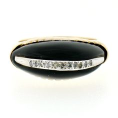 This unique vintage ring is crafted in solid 14k yellow gold and stands out with a domed, custom cut black onyx which rises high across its center with 11 stunning diamond accents along its top. The sparking diamonds are old single cut and elegantly pave set in white gold settings that boost beautiful bright effects around the diamonds. The setting of the onyx perfectly holds the stone and displays on both sides delicate grooved work adding a lovely touch. A gorgeous vintage ring that is sure to Formal Black Dome Ring With Polished Finish, Oval Black Diamond Ring In 14k Gold, Vintage Black Diamond Round Ring, Formal Black Diamond Ring Stamped 14k, Vintage Black Round Diamond Ring, Classic Black Diamond Ring Stamped 14k, Heirloom Black Diamond Oval Ring, Heirloom Black Oval Diamond Ring, Collectible Black Rings With Polished Finish