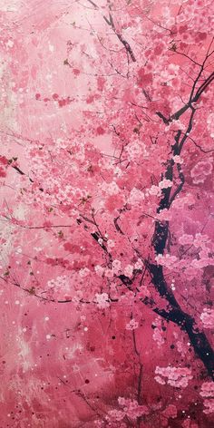 a pink tree with white flowers in the foreground