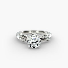 a white gold engagement ring with diamonds on it