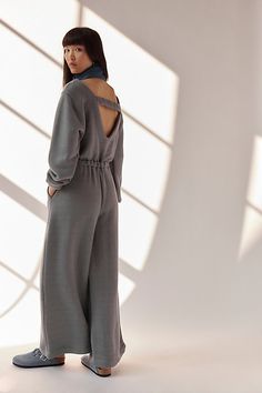 An effortless done-in-one from our free-est collection, this jumpsuit is the definition of cozy meets chic. **Fit:** Relaxed throughout with cinched waistband **Features:** Crew neckline, wide-leg silhouette, side pockets, back keyhole cutout, pull-on design **Why We ❤ It:** Throw-on-and-go with simple sneakers or elevate it with sleek sandals — this style has endless ways to wear. | Darla One-Piece by free-est at Free People in Grey, Size: XS Chic Loungewear Jumpsuits And Rompers With Elastic Waistband, Chic Jumpsuits And Rompers With Elastic Waistband For Loungewear, Chic Jumpsuit With Elastic Waistband For Loungewear, Chic Loungewear Jumpsuits With Elastic Waistband, Chic Relaxed Fit Jumpsuits And Rompers For Lounging, Fall Season Relaxed Fit Jumpsuits And Rompers For Lounging, Chic Long Sleeve Jumpsuits And Rompers For Loungewear, Chic Long Sleeve Jumpsuits And Rompers For Daywear, Chic Loungewear Jumpsuits And Rompers