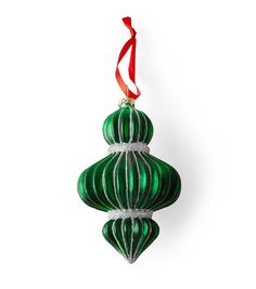 a green ornament hanging from a red ribbon