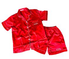 Our Delta Sigma Theta Satin Pajama Short Set is made from silky soft satin and is the perfect sorority gift.  The set includes a pajama shirt and shorts. Short sleeve pajama shirt with pocket. Above the knee length shorts.  DETAILS: - Each pajama set is carefully customized with Delta's Greek Letters. - Contrast Piping - Shorts come with an elasticated waist, drawstrings, and one pocket - Flattering neckline and cute collar - Soft satin fabric that looks and feels both rich and luxurious - Comfortable and relaxed fit SIZE GUIDE: US Sizing: We offer the following sizes: - Adult Sizes - Extra Small (XS), Small (S), Medium (M), Large (L), and Extra Large (XL), - Plus Sizes - 1X, 2X and 3X Please see the size chart and order accordingly. You will need to mention the PJ size in the Personalizat Casual Satin Sets For Pajama Party, Satin Sets For Pajama Party With Relaxed Fit, Satin Sleepover Set With Short Sleeves, Satin Short Sleeve Sleepover Sets, Short Sleeve Satin Sets For Home, Satin Sets With Short Sleeves For Home, Red Silk Pajamas, Sorority Pajamas, Silk Pj Set