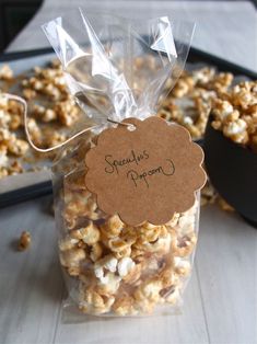 a bag filled with popcorn sitting on top of a table