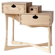 two wooden drawers sitting on top of each other