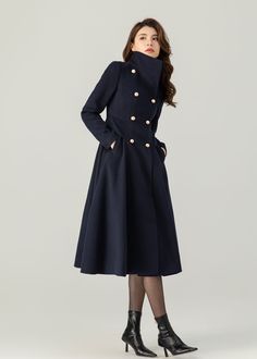 "FEATURES 50% wool, 50% wool blend Fully liner with polyester  With pockets Lapel collar or you can wear it stand up Long sleeve Button closure in front Fitted waist For Winter, Autumn Navy blue wool coat Double breasted wool coat dry clean ★★Mode size Height 170cm (5′ 7″)  Bust 84 cm (33\")  Waist 66 cm (26\")  She wears size XS. ★★Bespoke Order Service If you Request other color Request the length Your height is not between 155 cm- 175 cm Your weight is not between 47 kg -77 kg I can do it for Luxury Navy Pea Coat With Lapel Collar, Luxury Navy Wool Peacoat, Luxury Blue Peacoat With Button Closure, Luxury Navy Fitted Peacoat, Luxury Navy Wool Coat With Button Closure, Luxury Navy Long Sleeve Peacoat, Luxury Blue Peacoat With Buttons, Luxury Winter Pea Coat With Double Button Closure, Luxury Elegant Peacoat With Double Button Closure