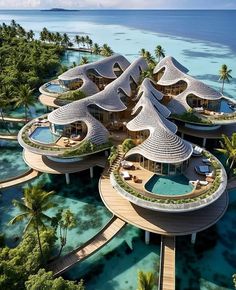 an aerial view of a tropical resort surrounded by water