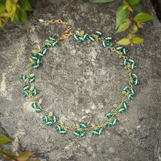 The Berry Emerald Necklace emanates elegance and sophistication. Crafted of brass, this stunning piece of jewelry is set with an eye-catching emerald, making it the perfect accompaniment for any sophisticated look. DETAILS Plating: 18K Gold Materials: 18K Gold on brass, Agate，Moissanite Measurements: Length:   13.39"(34cm)  + Extender: 3.54"(9cm) Weight:   30.31 g There will be a little difference among different production batches of products due to the variation of natural materials. Bohemian Gold Jewelry With Emeralds, Green May Birthstone Necklace For Wedding, Dainty Green Emerald Jewelry, Elegant Wire Wrapped Jewelry For Birthstone, Elegant Wire Wrapped Jewelry For May Birthstone, Green Brass Jewelry For Gifts, Green Brass Jewelry For Gift, Green Brass Jewelry As Gift, Green Brass Jewelry Gift