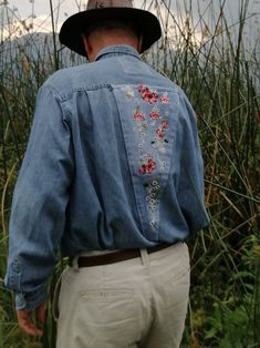 "This unique men's denim shirt and embroidered chambray shirt (chest 44) has a classic, loose cut for any outdoor activity. This Overshirt can be worn fully buttoned or effortlessly open. It's made from recycled light denim, a soft and tough fabric that hangs well while keeping its shape. Two flat button-closure pockets, a spread collar, give this casual button down shirt the perfect dose of character. Denim Dress Shirt details include flat buttons on the front placket, cuffs and pockets, a flor Spring Denim Shirt For Rodeo, Embroidered Denim Shirt For Summer, Summer Embroidered Denim Shirt, Embroidered Chambray Shirt, Tyler Childers, Embroidered Denim Shirt, Floral Patches, Denim Shirt Men, Button Down