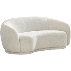 a white couch sitting on top of a white floor