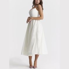 Step into elegance with our Spaghetti Strap A-Line fit and flare Midi Dress. This dress promises a graceful silhouette with its fitted bodice and flowing skirt. The spaghetti straps offer a delicate touch, perfect for both casual outings and special occasions. Made from lightweight, breathable fabric, it's designed for comfort without sacrificing style. Pair it with sandals for a relaxed look or heels to make a statement. Versatile and chic, this midi dress is a wardrobe must-have. Color: White, Brunch Dress With Fitted Bodice And Spaghetti Straps, Fitted Bodice Dress With Spaghetti Straps For Brunch, Spaghetti Strap Dress With Fitted Bodice For Brunch, Brunch Dress With Spaghetti Straps And Fitted Bodice, Elegant Sundress With Sweetheart Neckline For Spring, Feminine Midi Dress With Spaghetti Straps And Lined Bodice, Fitted Bodice Sundress With Spaghetti Straps, Spring Slip Dress With Spaghetti Straps And Lined Bodice, Midi-length Suspender Dress With Adjustable Straps For Brunch