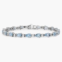 Captivating in color, this bracelet features vibrant aquamarine gemstones accented with sparkling round white sapphires framed in 14k white gold. Light Blue Gemstone Bracelet, Aquamarine And Gold Bracelet, Blue Stone Bracelet, Popular Bracelets, Precious Gemstones Jewelry, Sapphire Bracelet, Aquamarine Gemstone, White Sapphire, Gemstone Bracelets