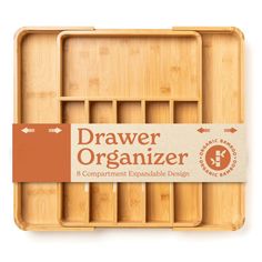 the drawer organizer is made out of bamboo and has compartments for different types of items