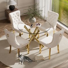 a round glass table with white chairs and a cat on the floor