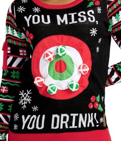 a woman wearing an ugly christmas sweater with the words you miss, you drink on it