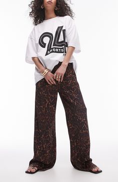 Fierce animal print covers these lightweight pants designed with roomy wide legs and a comfortable elasticized drawstring waist. 29 1/2" inseam; 22" leg opening; 12" front rise; 15" back rise (size ts-8) Elastic/drawstring waist 100% viscose Machine wash, line dry Imported