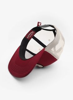 - Burgundy crown- Beige mesh for breathability- Medium profile- Structured 6-panel- Merrowed-edge woven patch- Woven flag at back- Flat bill- One size fits most Sports Mesh Trucker Hat With Logo Patch, Sporty Mesh Baseball Cap With Logo Patch, Burgundy Crown, Oxnard California, Flag, Crown, California, Mesh