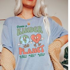 CREATE A KINDER PLANET. There is no Planet B! We love Bella + Canvas tees! A Unisex tee that's a perfect fit for every body. Soft and lightweight crewneck that fits like a well-loved favorite. ❤ If you would like the oversized fit look, please purchase a size 2 times larger than your regular size. ❤ ✦ PRODUCT INFO ✦ ▸ All items are printed just for you using water based eco-friendly & biodegradable inks.  ▸ 100% ring-spun cotton.  ▸ Sewn-in label. ▸ Please note: Colors may differ slightly in person than on a monitor or phone. ✦ CARE INSTRUCTIONS ✦ ▸ Machine wash cold, inside-out on a gentle cycle with a mild detergent and like colors. ▸ Tumble dry on low. ▸ Do not bleach and do not iron directly on design. ✦ SHIPPING TIMES ✦ Our products are processed & printed just for you when you order! Relaxed Fit Letter Print Tops For Earth Day, Cute Long Sleeve Shirt With Funny Print, Earth Day Letter Print Crew Neck Top, Letter Print Crew Neck Top For Earth Day, Casual Text Print Tops For Earth Day, Fun Printed Shirt With Relaxed Fit, Earth Day Text Print Crew Neck Top, Casual Screen Print Tops For Earth Day, Casual Earth Day T-shirt With Screen Print