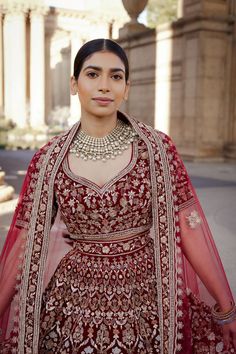 Rowan - Glamourous Maroon Velvet Lengha choli with Dabka & Resham embroidery Look like royalty and be treated like a queen that you are in this luxurious ensemble that's sure to blow everyone's mind! Designer princess cut neckline velvet choli blouse with threadwork Luxurious velvet fabric of maroon shade makes this custom blouse a soft finish Princess neckline adds an extra uniqueness to this elegant designer choli Princess cut patterning from shoulder line that aims to give you the right fit I Maroon Velvet Lehenga, Lehenga For Reception, Velvet Lengha, Velvet Choli, Velvet Bridal Lehenga, Designer Choli, Indian Bridal Couture, Velvet Lehenga, Bridal Lengha