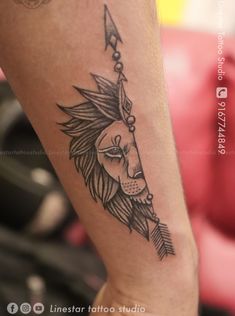 a woman's arm with a tattoo on it and an arrow in the center