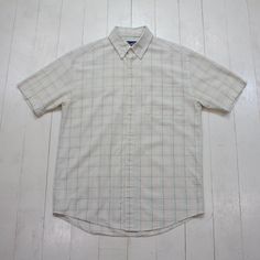 2000s/2010s Arnold Palmer Windowpane Seersucker Button Down Short Sleeve Shirt Size M/L condition - very good - tiny mark tagged M - fits oversized - please consult measurements  22" pit to pit  30.5" length    Please contact us if you have more questions about this garment. Classic Plaid Cotton Short Sleeve Shirt, Classic Cotton Short Sleeve Plaid Shirt, White Yarn-dyed Short Sleeve Shirt, Arnold Palmer, Button Down Short Sleeve, Button Down, Short Sleeve Shirt, Sleeve Shirt, Gender Neutral