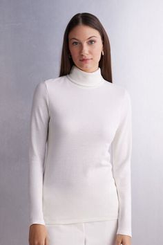 Long sleeve high collar top in 100% natural fabric with cotton against the skin and a soft and warm wool and silk blend exterior. Very comfortable breathable fabric suitable for the coldest weather but also perfect for the most delicate and sensitive skin. Very versatile basic line ideal either worn on its own or underneath a shirt or jacket. Regular fit.
The model is 5’ 9” (175 cm) tall and is wearing a size S. Turtle Neck Jumper, Natural Fabric, Collar Top, Turtle Neck Top, Knitwear Women, Natural Fabrics, High Collar, Cotton Tops, Breathable Fabric