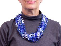 Shimmering, handmade trellis yarn necklace has a unique jeweled appearance.  The necklace scarf is available in two sizes: 24 inch or 30 inch circumference. It has approximately 40 loops of beautiful blue & white toned yarn. Each strand of yarn is 1/4 inch wide. It is tied with neat, secure knot and will slip easily over your head. It falls like a silky scarf but without the bulk, comfortably dressing up a solid color shirt, blouse or dress. Nylon yarn is lightweight, cool and can be hand washed. You are sure to get many compliments when you wear this colorful necklace. It makes a unique gift for your wife, sister, mother or teacher! QUICK FACTS: - Choose between a 24 inch or 30 inch circumference. - Approximately 40 loops of ribbon yarn. - Necklace knot is securely tied and slightly burne Secure Knot, Ladder Yarn, White Trellis, Necklace Scarf, Yarn Necklace, Colorful Necklace, Ribbon Yarn, Loop Scarf, Silky Scarf