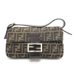 Item Information ITEM NO.: G-210225-10 NAME: FENDI FF logo Zucca pattern Mamma Baguette Flap shoulder bag Shoulder Bag SHAPE: Shoulder Bag MODEL NO.: 2321.26424 COLOR: BrownBasedxSilverHardware MATERIAL: Canvas/Leather APPROX SIZE: W9.9×H5.5×D1.5inch / W25.2cm×H14cm×D3.8cm The Shoulder part is adjustable. Listed hand measurements may have a 1-2cm difference. Gender: Women's Spec: [Open type]Magnet type [Inside] Zipper pocket x 1 ADDITIONAL ITEMS: None ITEM RANK: Used AB Rank CONDITION DETAILS: O Target Lady, Fendi Shoulder Bag, Ff Logo, Bag Model, Canvas Leather, Leather Accessories, Bag Pattern, Wallet Case, Bag Sale