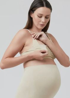 Experience unparalleled comfort and support during pregnancy and nursing with our Seamless Nursing Bra. The expertly designed knit structure and adjustable clip-release straps make breastfeeding a breeze, while the ruched front adds additional comfort and support. A must-have for expecting and new mothers. Polyamide / Elastane Clip release for nursing Adjustable straps Hook and eye closure Maternity Intimates, Bra Hooks, Knit Structure, Bra Cup, Breast Feeding, Jumpsuit Outfit, Nursing Tops, Nursing Dress