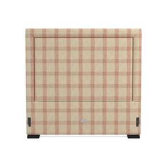 an upholstered beige and brown checkered fabric headboard