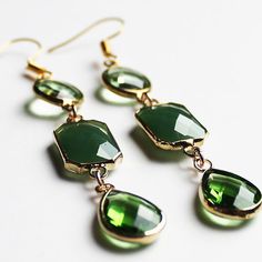 These cute hand-crafted faceted green multi-tier Crystal Earrings come in multiple designs Stone: Crystal Colour: Green Metal: Gold Plated Earring Size: 7cm Drop x 1cm Width (3 tier) or 5cm Drop x 1cm Width (2 tier) Green Dangle Jewelry With Faceted Beads, Handmade Green Crystal Drop Earrings, Green Crystal Earrings For May Birthstone Gift, Green Crystal May Birthstone Earrings For Gift, Green Dangle Crystal Earrings For Gift, Green Drop Crystal Earrings, Green Crystal Drop Earrings For Gift, Green Emerald Dangle Chandelier Earrings, Green Emerald Drop Crystal Earrings