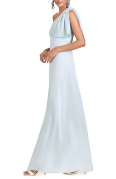 Subtly angle for attention in this satin-charmeuse gown with a waistline seamed to parallel the neckline and a bow detail with a large draping one shoulder. 61" regular length (size 8) Hidden side-zip closure One-shoulder neck Sleeveless Lined 100% polyester Dry clean Imported Asian Owned/Founded One-shoulder Evening Dress With Pleated Bodice For Wedding, One Shoulder Evening Dress With Pleated Bodice For Wedding, One-shoulder Wedding Gown With Pleated Bodice, Elegant Pleated Bodice One Shoulder Wedding Dress, Elegant One-shoulder Dress With Pleated Bodice For Wedding, One Shoulder Gown With Pleated Bodice For Evening, Elegant One Shoulder Dress With Pleated Bodice For Wedding, Elegant One Shoulder Wedding Dress With Pleated Bodice, One-shoulder Satin Finish Dress For Wedding