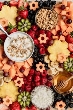 a platter filled with fruit, cereal and nuts