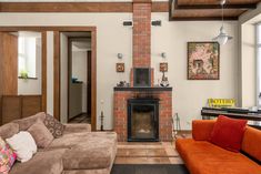 a living room filled with furniture and a fire place