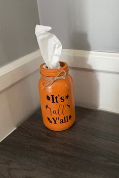 an orange mason jar that says it's fall y'all