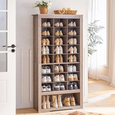 a wooden shoe rack filled with lots of shoes