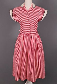 VTG 40s 50s Dress A striped dress from the 1940s-50s era. It is in good vintage condition. One of the armpits appears to have been mended. The collar and cuffs have some discoloration, and there is a small snag on the right hip. There is no size label, but it would fit closest to a contemporary size small. This is a vintage item with a unique cut so please check the measurements before purchasing. Measurements Laying Flat: Bust: 16.5" Waist: 13.75" Hip: Open Sleeve Length: 2.25" Length: 43" This 1950s Style Red Lined Dress, 1950s Red Lined Dress, Red Vintage Dress For Vintage Events, 1950s Style Red Vintage Fashion Dress, 1950s Red Vintage Fashion Dress, 1950s Style Red Dress For Vintage Fashion, Red Vintage Dress In 1950s Style, Red Cotton Vintage Dress, Vintage Red Dress With Buttons