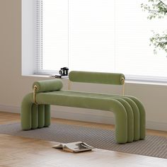 a green bench sitting on top of a hard wood floor