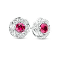 Charm and delight with the mesmerizing love knot design of these red lab-created ruby and diamond stud earrings. Fashioned in sterling silver Each earring glistens with a 4.0mm round bright red lab-created ruby. A sculpted knot frame of diamond-touched and polished ribbons surrounds the center stone. These 1/20 ct. t.w. diamond post earrings secure comfortably with friction backs. Elegant Round Cut Earrings For Valentine's Day, Ruby Jewelry With Prong Setting And Round Cut, Brilliant Cut Ruby Round Earrings, Dazzling Jewelry With Brilliant Cut Lab-created Ruby, Ruby Jewelry With Round Accent Stones, Ruby Jewelry With Diamond Accents, Round Ruby Jewelry With Diamond Accents, Red Cubic Zirconia Birthstone Jewelry, Ruby Round Earrings In White Gold