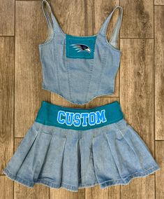 The cutest denim set customized for your school, team or company!  The front of the skirt has a button closure as shown in the second pic.  therefore, the fabric patch on the skirt is on the back of the skirt.  -Fabric patches of t shirts are sewn over the denim set -Fabric and text colors will match your school/team/company colors. Custom Game Day Clothes, Vintage Game Day Tops With Team Name, College Style T-shirt With Team Name For Game Day, Cotton Game Day Top With Mascot, Team-colored Fitted Top For Game Day, Denim Crop Top, School Team, College Team, Womens Pyjama Sets