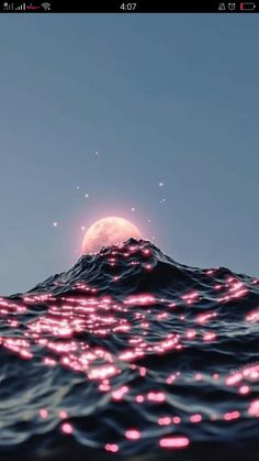 an image of the ocean at night with pink lights on it and a full moon in the background