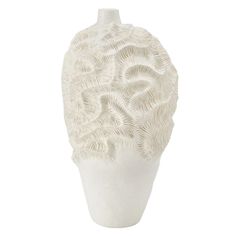 a white vase with an intricate design on the top and bottom, sitting against a white background