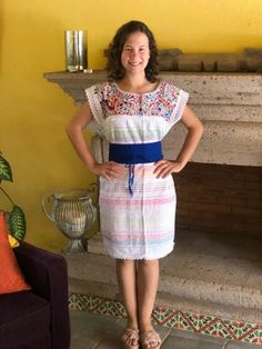 This handmade Mexican dress is made on a pedal loom, with beautiful bright-colored embroidery on silk thread, and lace details. It can be worn with or without a belt. Belt not included. Each dress has a unique embroidery, so colors may vary. Mexican textile art has centuries of history and creativity throughout the country. Mexico is recognized as one of the leading countries with a beautiful aristic production in the textile world, miraculous hands of talented artisans from different states of Folk Style Handwoven Cotton Dress, Multicolor Folk Style Dress For Fiesta, Folk Style Multicolor Dress For Fiesta, Folk Style Multicolor Embroidery Dress For Fiesta, Multicolor Folk Dress For Fiesta, Multicolor Embroidered Fiesta Dress, Multicolor Embroidered Dress For Cinco De Mayo Fiesta, Folk Style Dress With Embroidered Border For Fiesta, Cinco De Mayo Fiesta Dress With Multicolor Embroidery