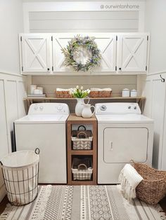 a white washer and dryer sitting next to each other in a laundry room