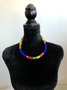 "The thick necklaces are approximately 19\" long with a 14\" tie. They are about 0.5\" in diameter. These are real Zulu beaded necklaces from South Africa or the Congo made with glass beads. They come in various colors and styles. Each piece is unique. Please make sure to check out our other listings for different colors." Adjustable Multicolor Crystal Necklaces With Large Beads, Adjustable Multicolor Crystal Necklace With Large Beads, Traditional Adjustable Single Strand Beaded Necklaces, Traditional Adjustable Single Strand Beaded Necklace, Adjustable Large Beads Choker Necklace, Adjustable Multicolor Single Strand Beaded Necklace, Adjustable Rainbow Necklaces With Polished Beads, Adjustable Rainbow Polished Beads Necklace, Multicolor Single Strand Choker