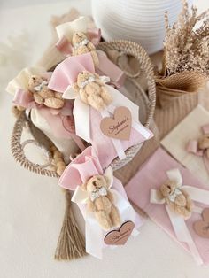 a basket filled with teddy bears sitting on top of a table next to other items